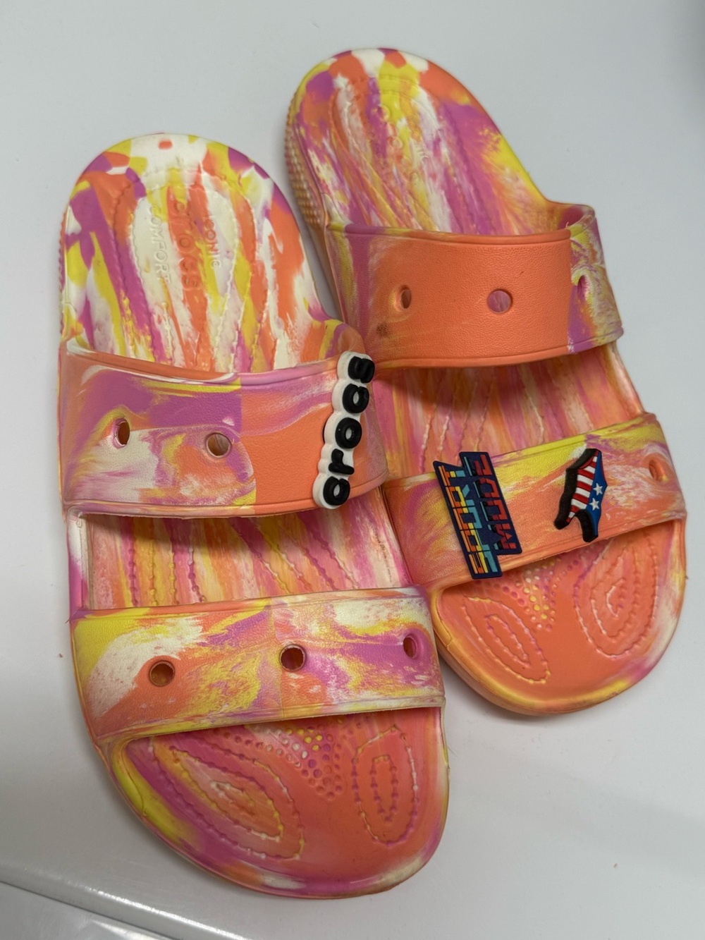 CROCS: Orange Pink Yellow Swirl. Comfy for pool and beach summertime!